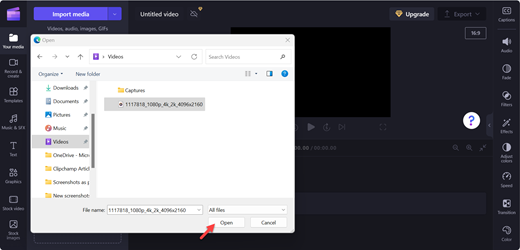 A screenshot of a Clipchamp editor's page with a pointer on Open button after selecting the desired video from your files.